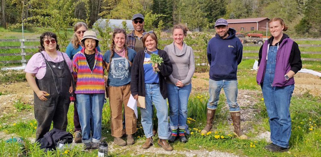 Salish Roots Farm tour and work party, 2024 (people standing in garden at Salish Roots Farm)